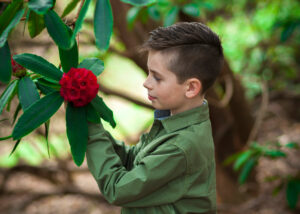 Young man enjoying spring flowers at Virigina Waters