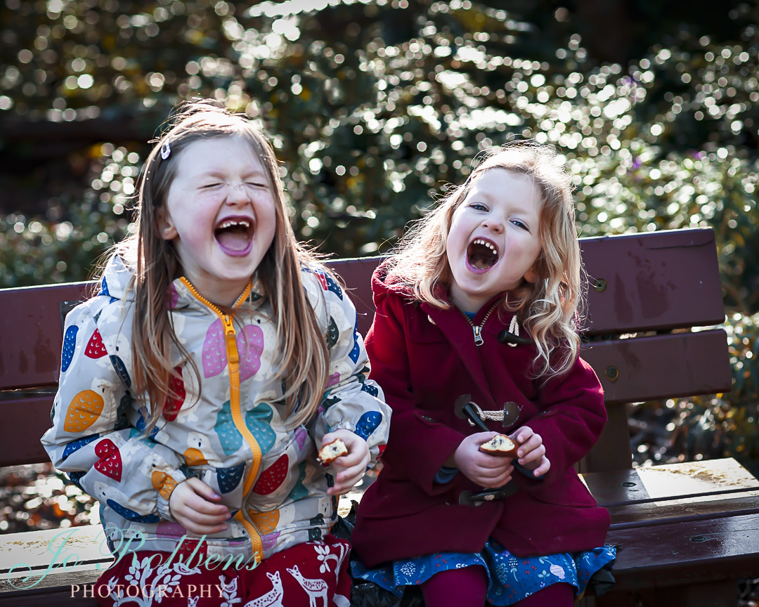 Two children giggling on a Photoshoot - Hampton Court Family Photographer