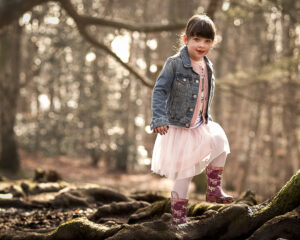 Esher Family Photographer - young lady exploring Esher Commons
