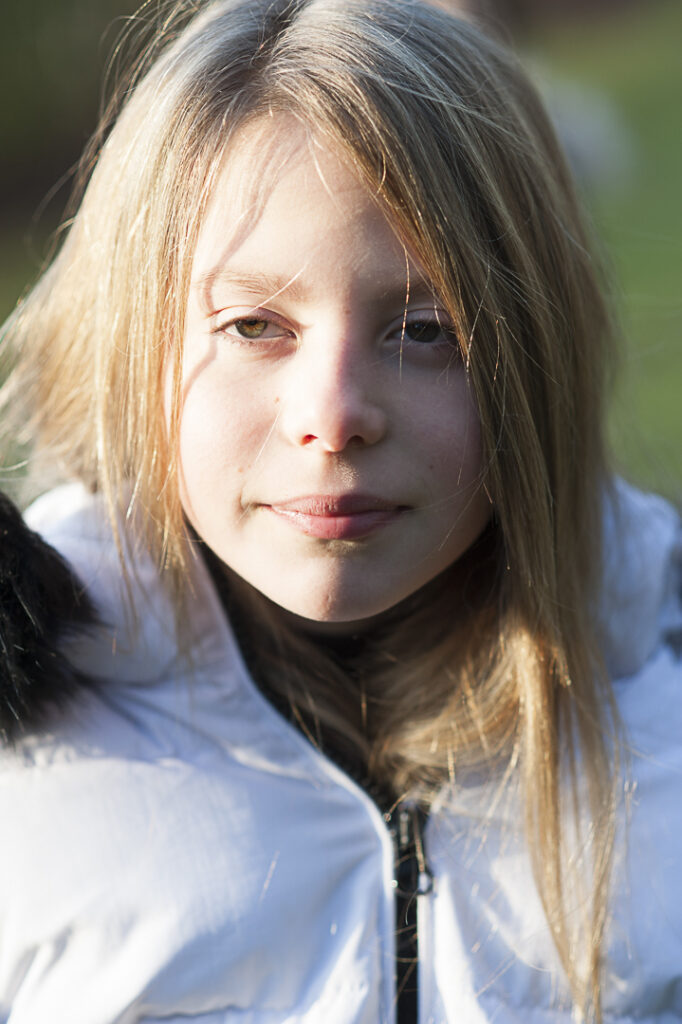 Girl stood in direct sunlight 