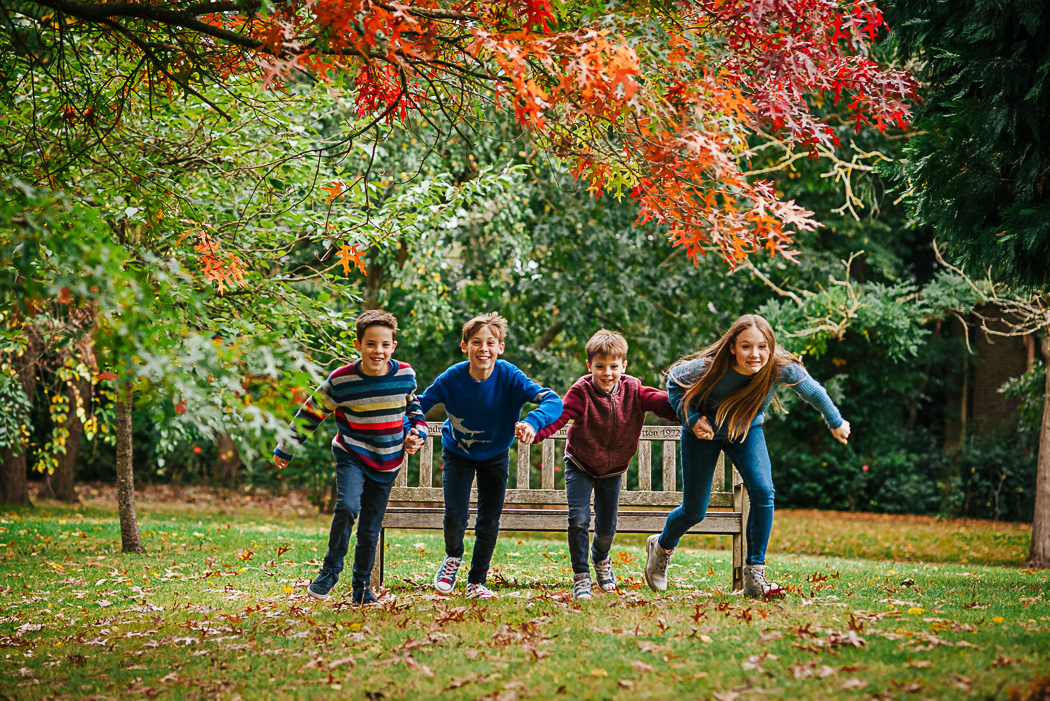 Children playing on a family photoshoot in Surrey