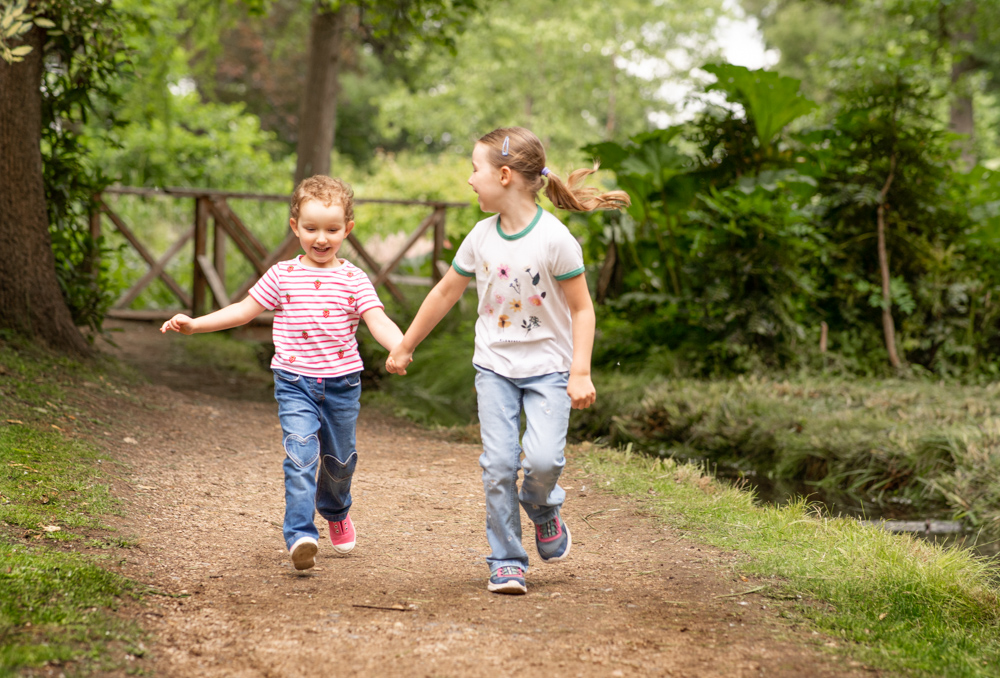 Girls having fun on family photoshoot in Surrey